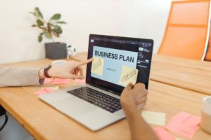 Pic of laptop with business plan powerpoint